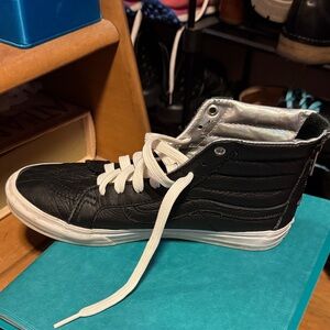 Black High-Top Vans with White Laces